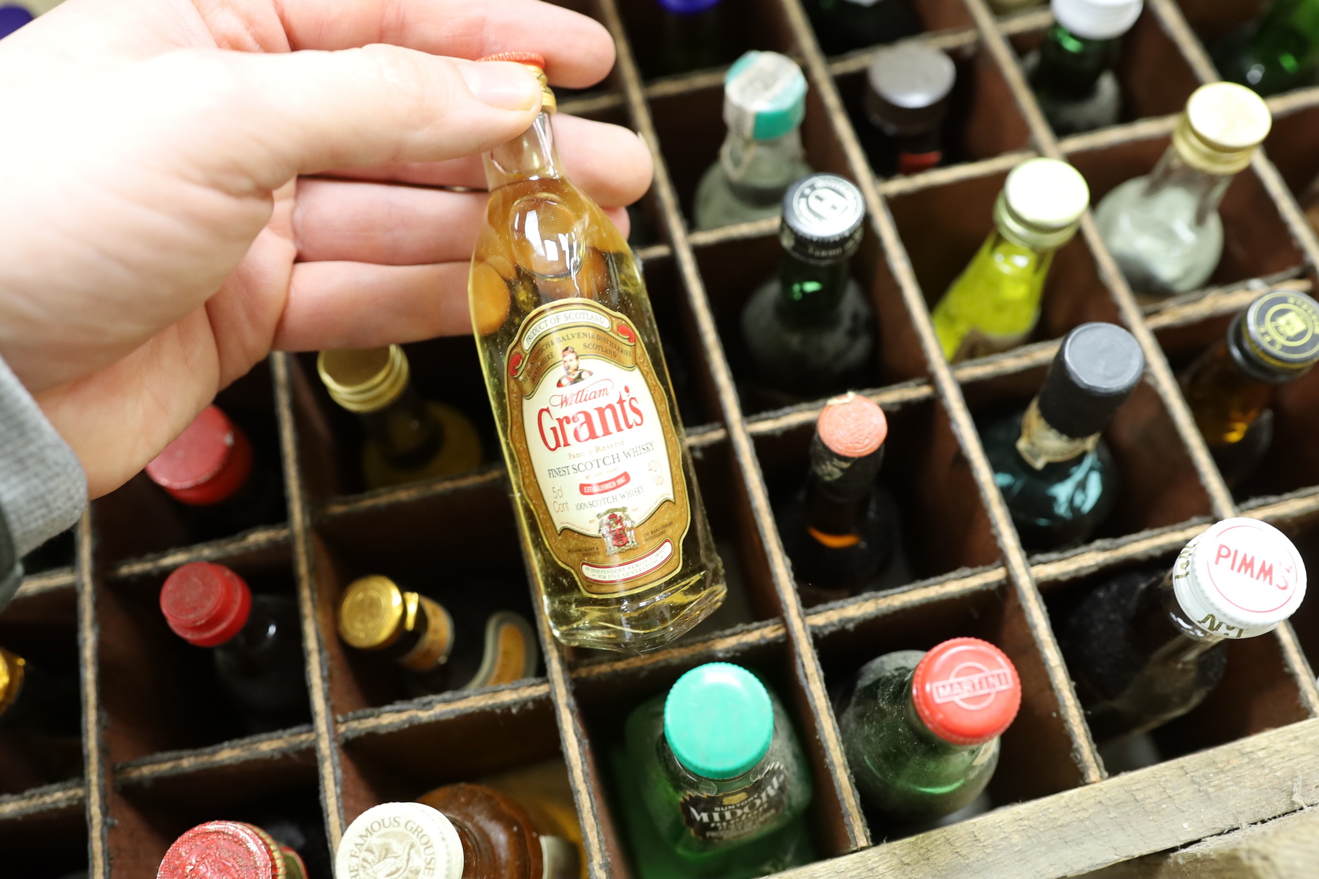 Sixty miniature spirits in collectors wooden box
